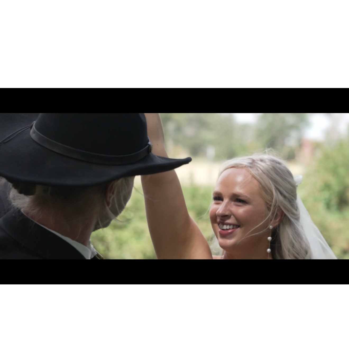 Bride smiling during a candid wedding film moment
